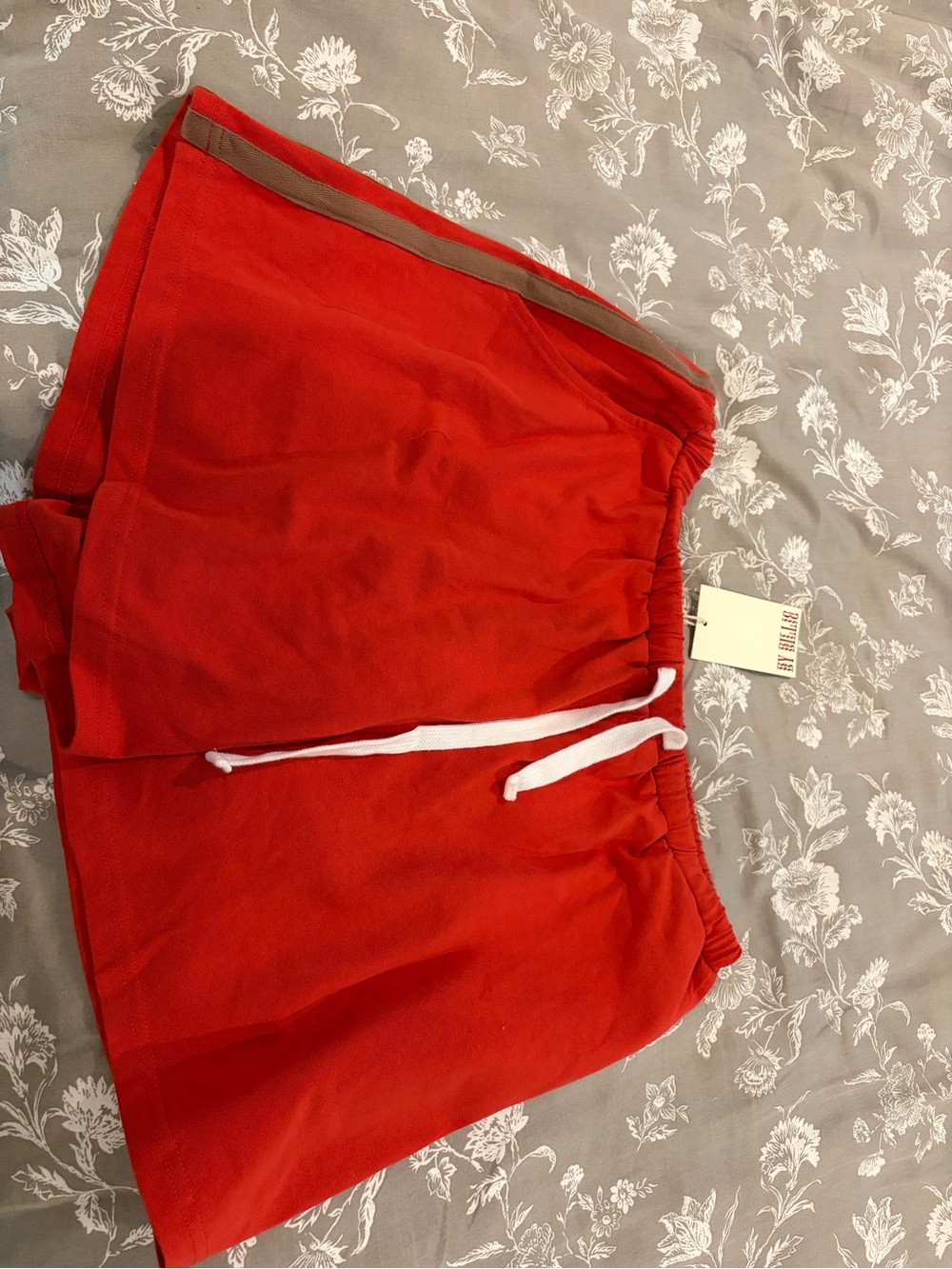 Women's Red Athletic Shorts with White Drawstring and Tan Trim